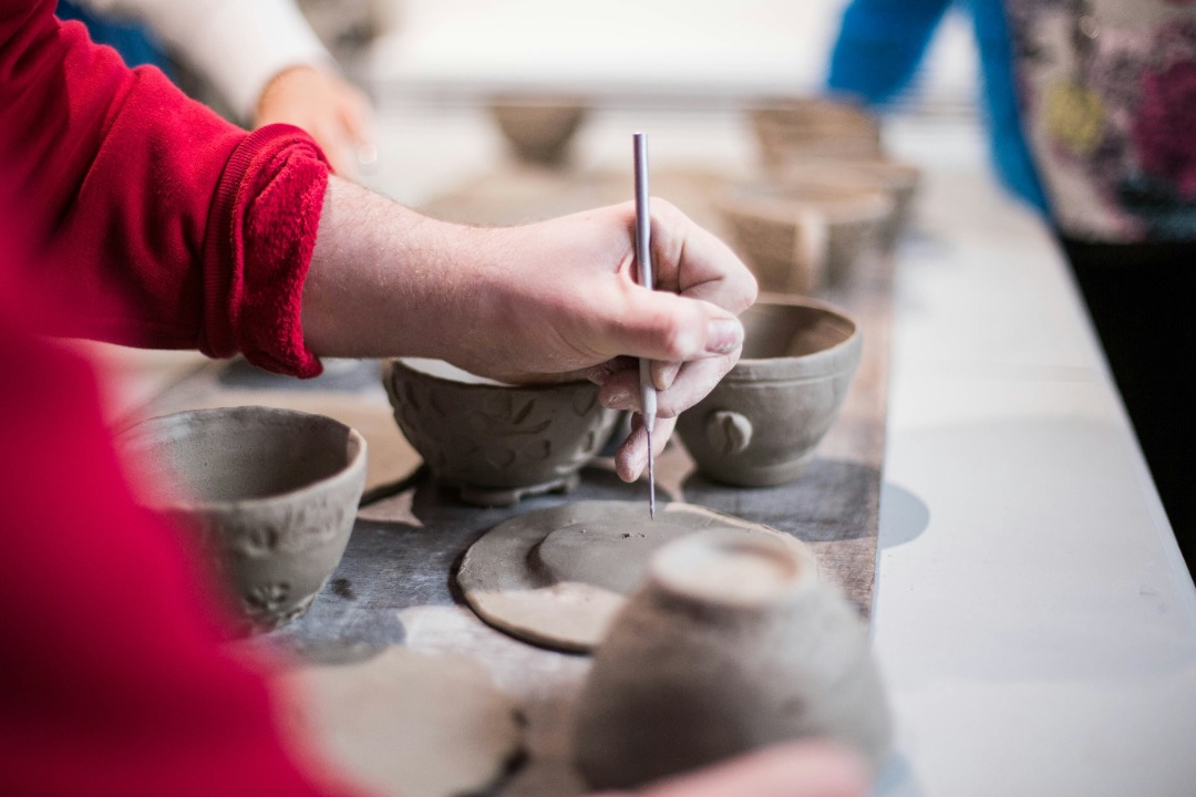 Artist creating pottery